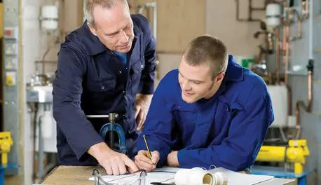 MODEL RELEASED, Plumber and apprentice