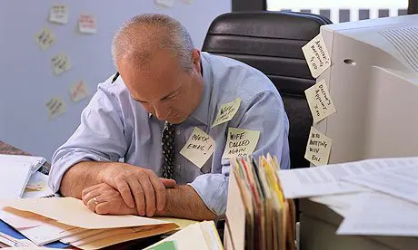 Overworked Businessman Wearing Sticky Notes