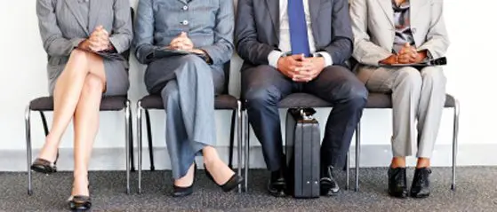 row-of-male-and-female-businesspeople-sitting-down
