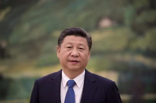 China’s President Xi Jinping looks on before meeting with former U.S. Secretary of State Henry Kissinger at the Great Halll of the People in Beijing