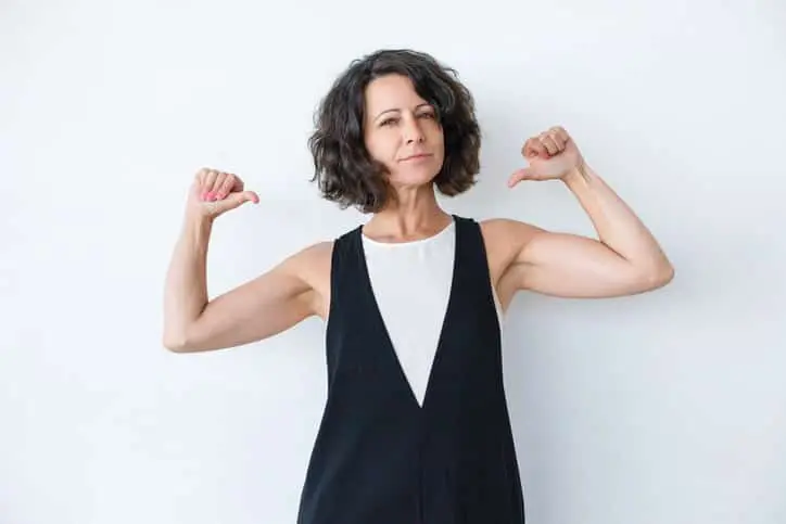 Confident woman pointing at herself