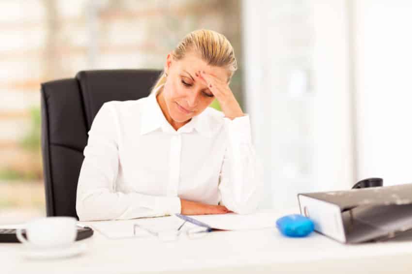 middle aged businesswoman looking worried