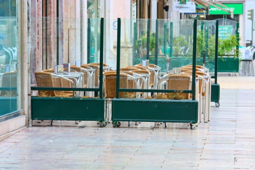 empty tables in street cafe