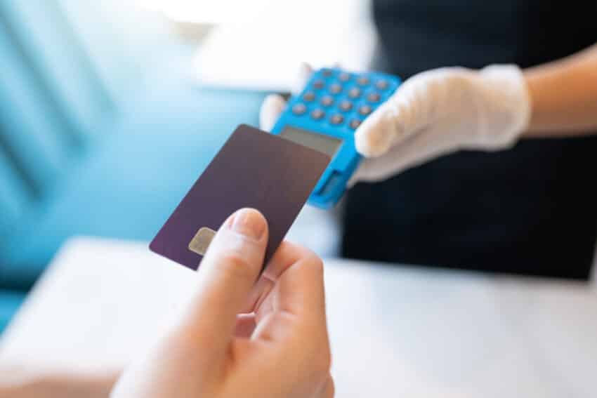 Customer Paying Through Credit Card In Restaurant