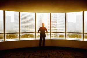 Business Man looking out the window