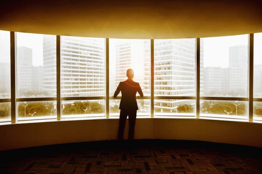 Business Man looking out the window