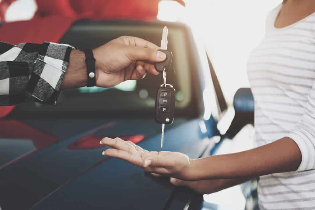 Close,Up,Man,Is,Giving,Keys,To,Woman.,African,American