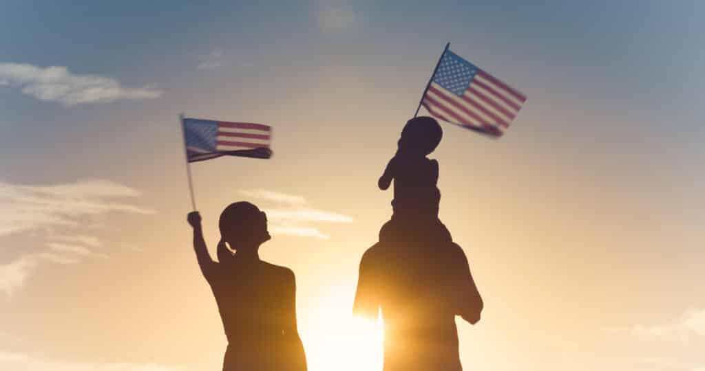 Patriotic,Silhouette,Of,Family,Waving,American,Usa,Flags.