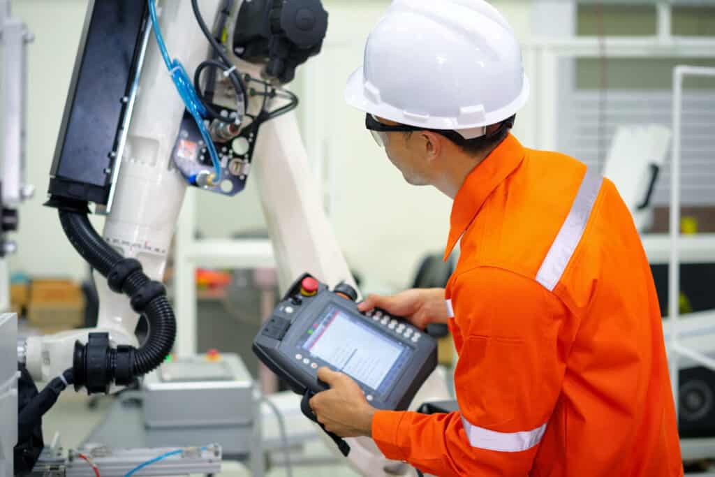 Smart,Factort,Concept:,An,Engineer,Use,Handheld,Controller,Setting,Industrial