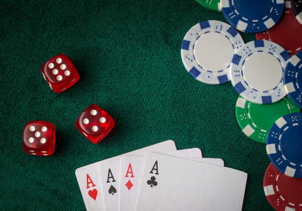 Playing,Cards,,Dice,And,Poker,Chips,From,Above,On,The