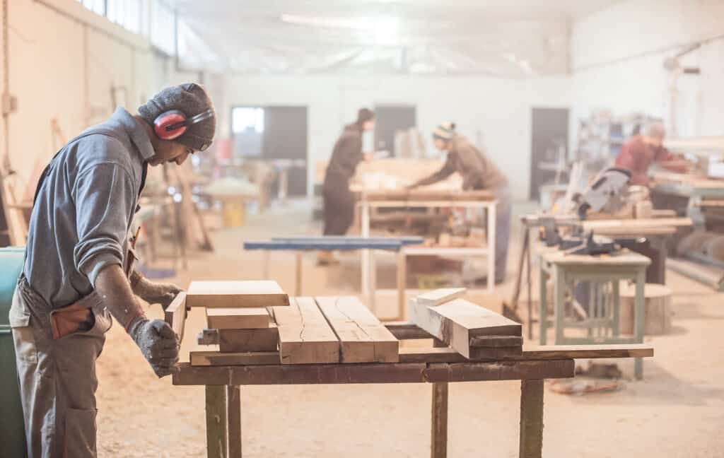 Man,Doing,Woodwork,In,Carpentry.,Carpenter,Work,On,Wood,Plank