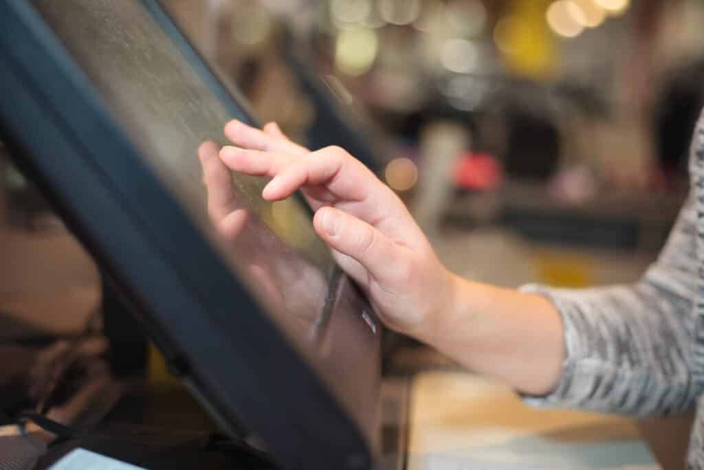 Young,Woman,Hand,Charging,A,Payment,For,A,Some,Clothes