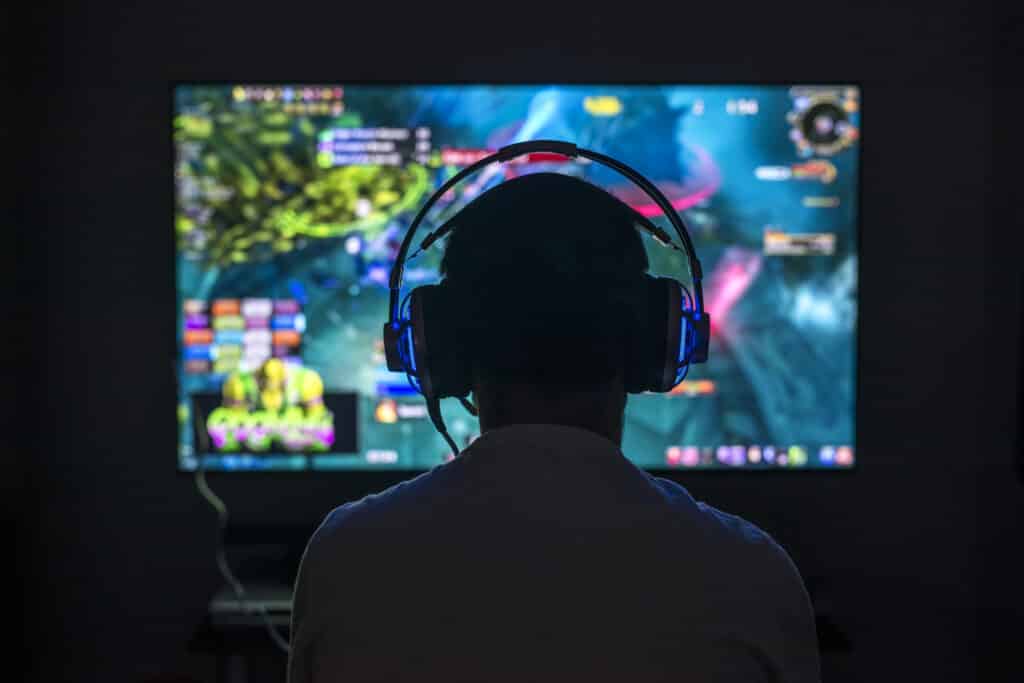 Young,Gamer,Playing,Video,Game,Wearing,Headphone.