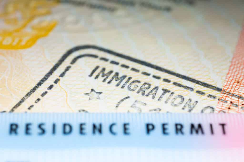Immigration,Concept,Image.,Residence,Permit,Card,Over,Immigration,Stamp,On
