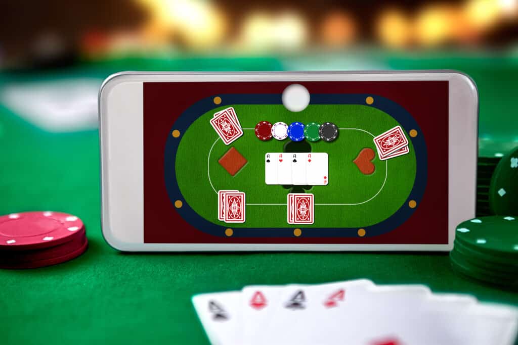 Smartphone,With,Poket,Table,On,Screen,,Playing,Cards,And,Chip