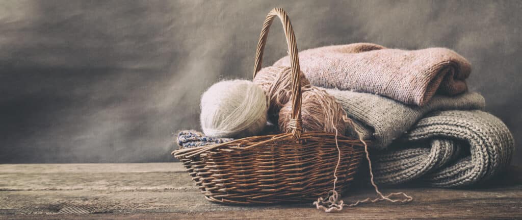 Knitted,From,A,Gray,Yarn,Sweater,And,Thread,For,Knitting