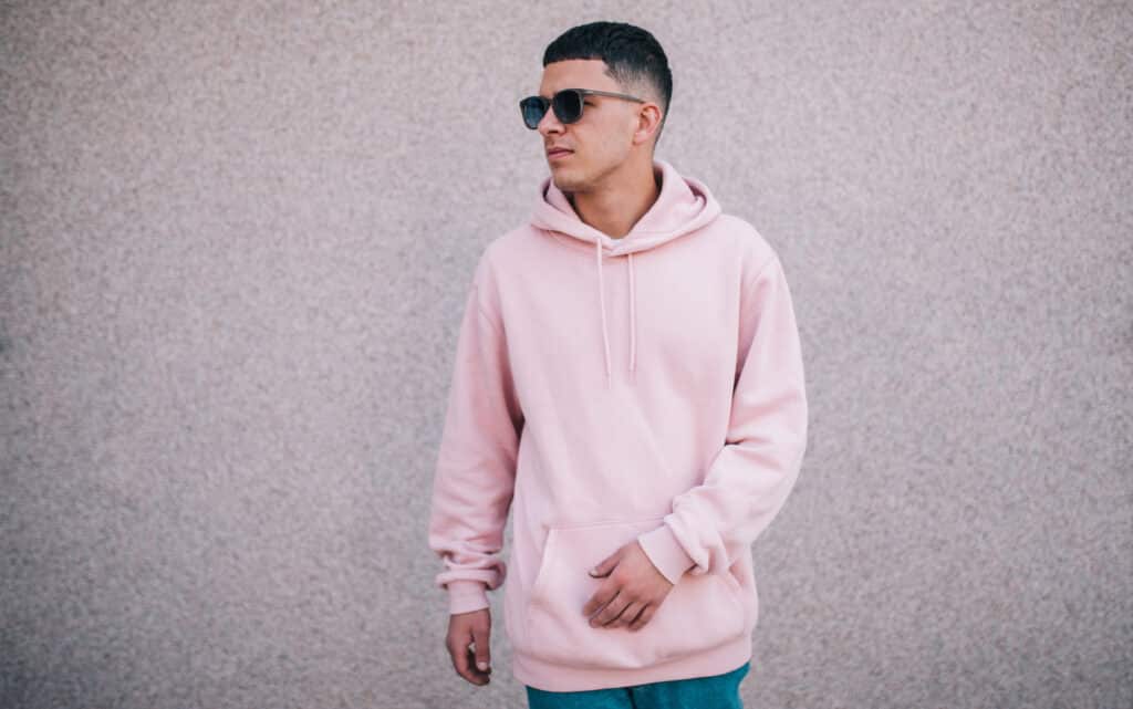 City,Portrait,Of,Handsome,Hipster,Guy,Wearing,Pink,Blank,Hoodie