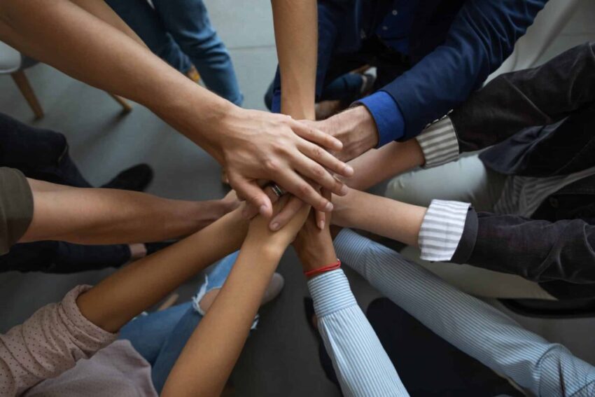 Close,Up,Mixed,Race,Business,People,Putting,Hands,Together,,Support