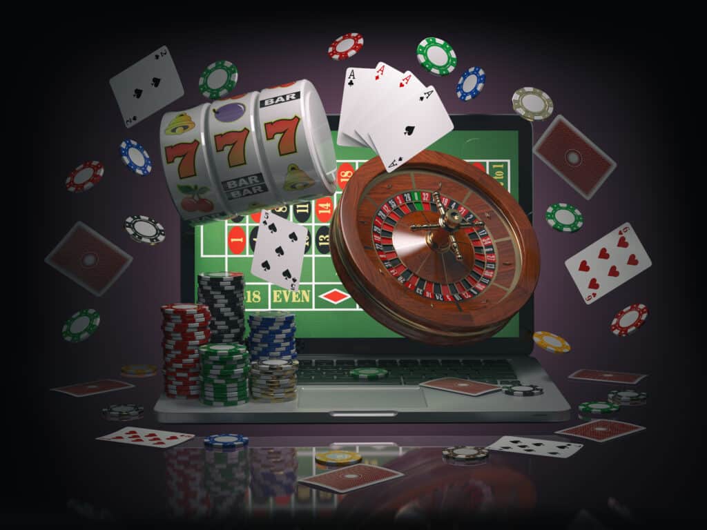 Online,Casino,Concept.,Laptop,With,Roulette,,Slot,Machine,,Casino,Chips