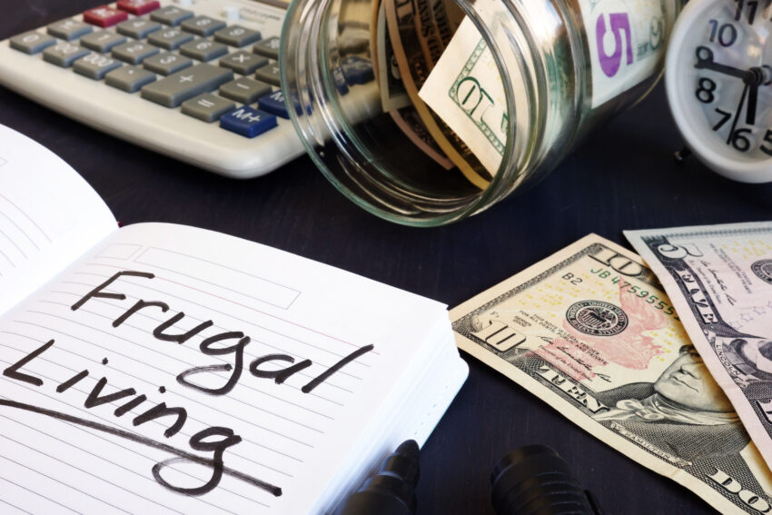 Frugal,Living,Written,On,A,Note,Pad,And,Money.