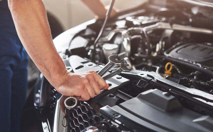Picture,Showing,Muscular,Car,Service,Worker,Repairing,Vehicle.