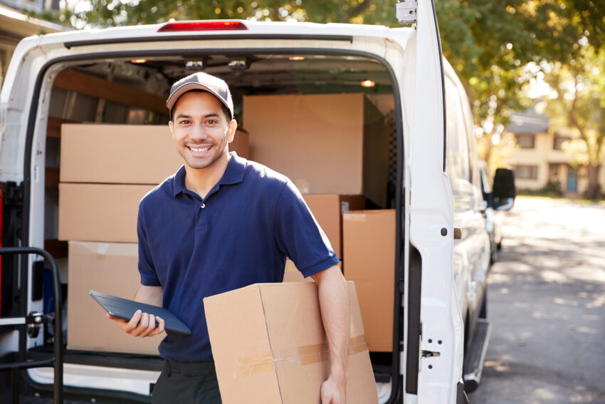 Portrait,Of,Courier,With,Digital,Tablet,Delivering,Package