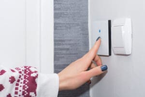 Girl,Hand,Turn,Off,Light,On,Smart,Touch,Switch.,Modern