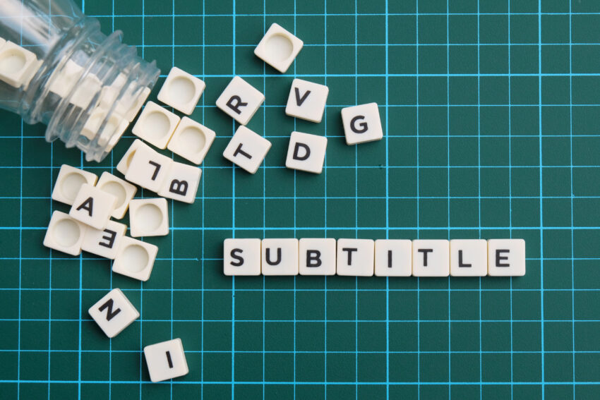 Subtitle,Word,Made,Of,Square,Letter,Block,On,Green,Square