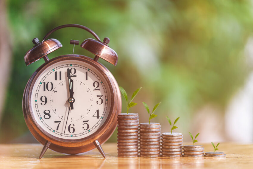 Money,Coin,Stack,Growing,Graph,With,Alarm,Clock,To,Profit
