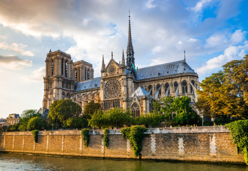 Gorgeous,Sunset,Over,Notre,Dame,Cathedral,With,Puffy,Clouds,,Paris,
