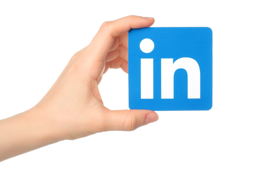 Kiev,,Ukraine,-,March,7,,2015:,Hand,Holds,Linkedin,Logo