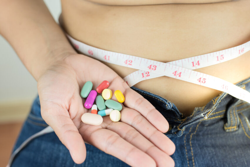 Weight,Loss,Unhealthy,And,Dangerous,Concept,,Woman,Measuring,Her,Waist
