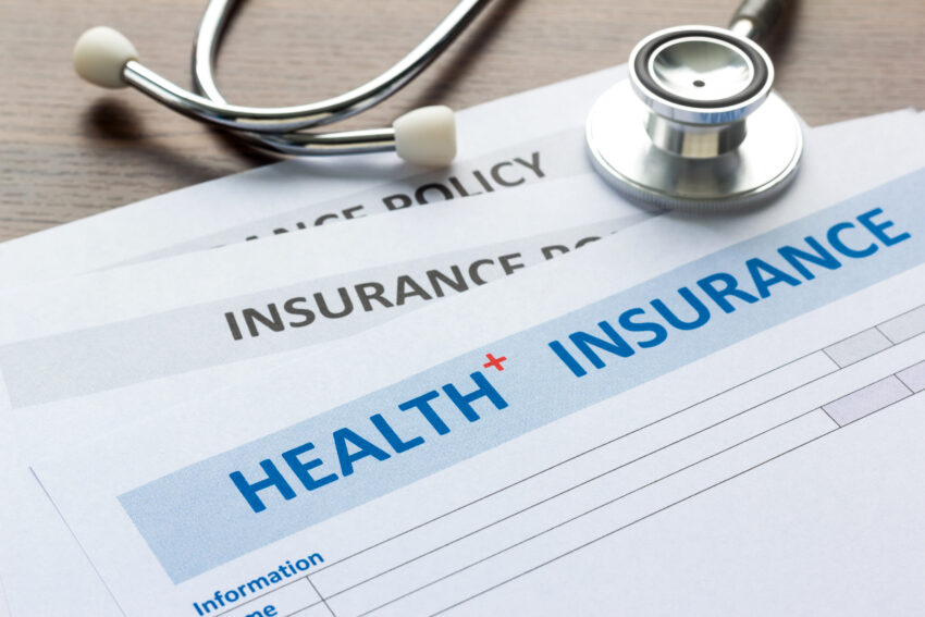 Health,Insurance,Form,With,Stethoscope,In,Top,View