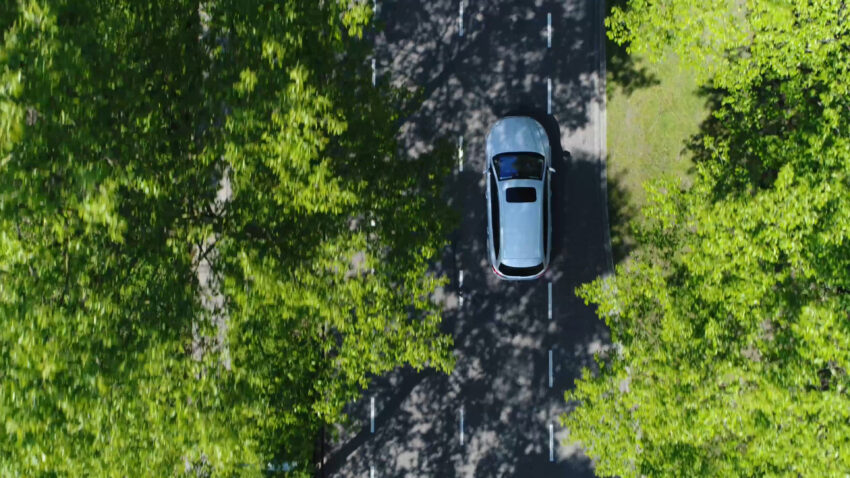 Aerial,Top,Down,View,Of,Grey,Station,Wagon,Vehicle,Overtaking