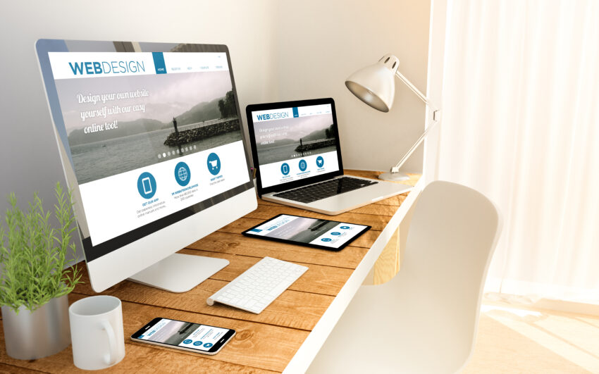 Digital,Generated,Devices,Over,A,Wooden,Table,With,Responsive,Design