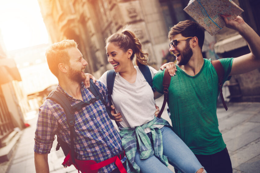 Happy,Traveling,Tourists,Sightseeing,With,Map,In,Hand