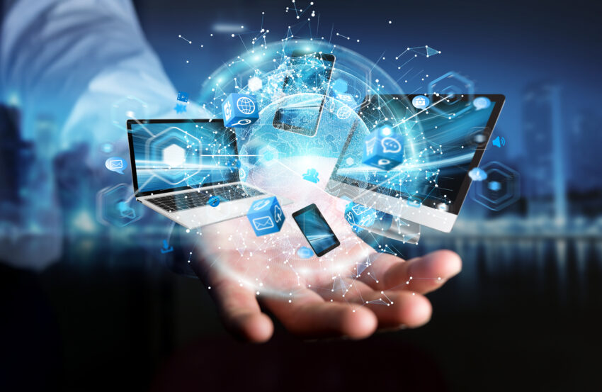 Tech,Devices,Connected,To,Each,Other,By,Businessman,On,Blurred