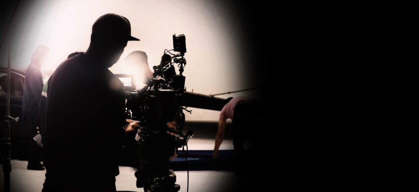 Behind,Video,Camera,In,Film,Or,Movie,Production,On,Tripod