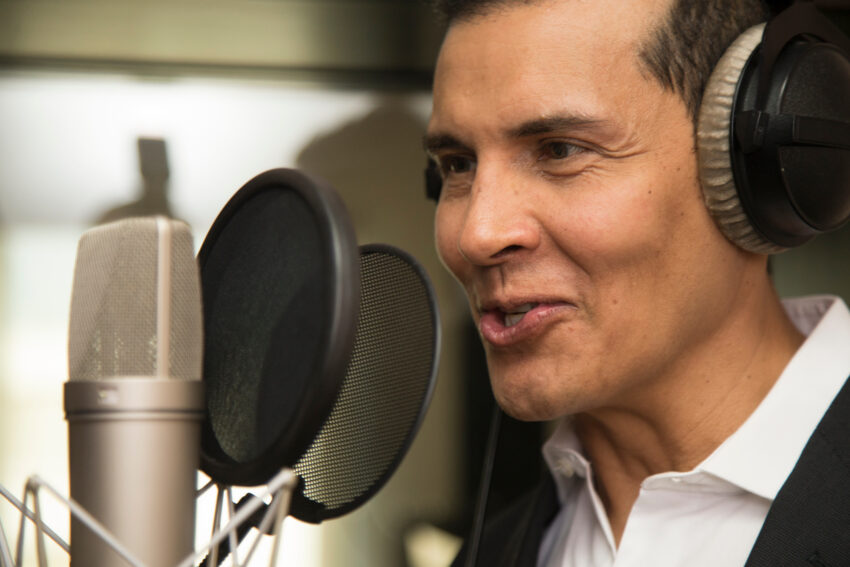 Actor,And,Radio,Announcer,With,Headphones,And,Microphone,Working,Film
