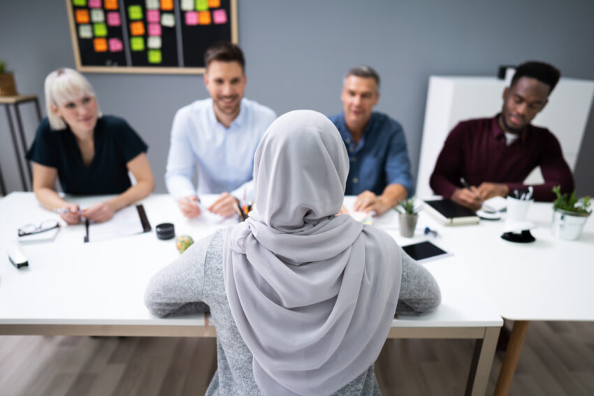 Muslim,Woman,In,Hijab,Sitting,At,Interview,In,Office
