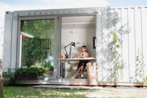 Mature,Woman,Working,Indoors,In,Home,Office,In,Container,House