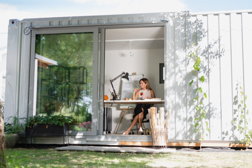 Mature,Woman,Working,Indoors,In,Home,Office,In,Container,House