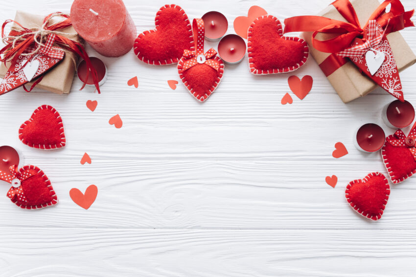 Wooden,White,Background,With,Red,Hearts,,Gifts,And,Candles.,The