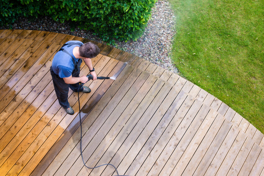 Man,Cleaning,Terrace,With,A,Power,Washer,-,High,Water