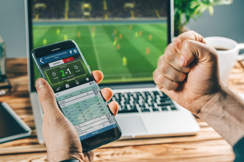 Man,Watching,Football,Play,Online,Broadcast,On,His,Laptop,,Cheering