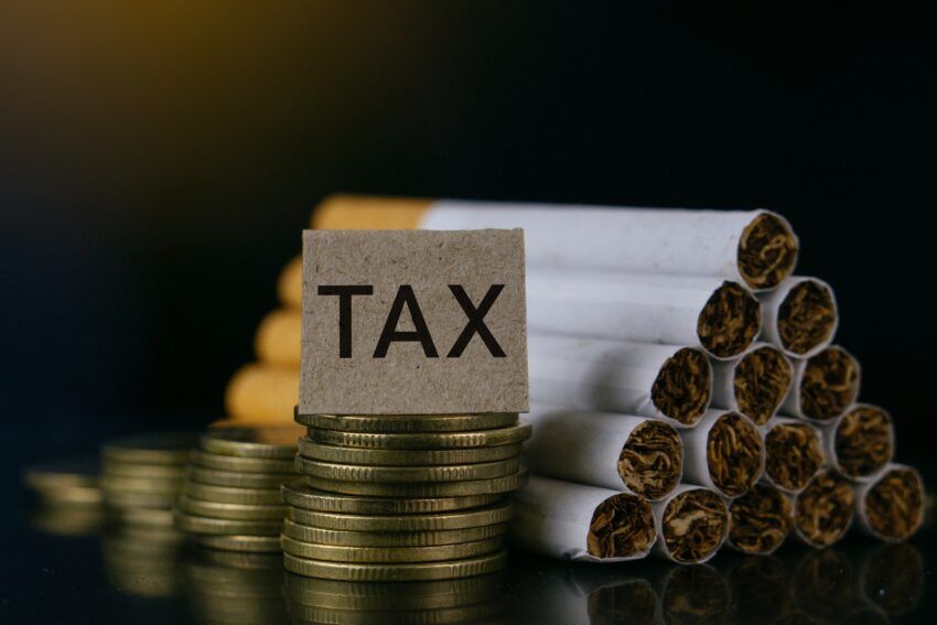 Cigarettes.tobacco,Cigarettes,And,Tax,Word,On,Black,Background.cigarettes,And,Tax