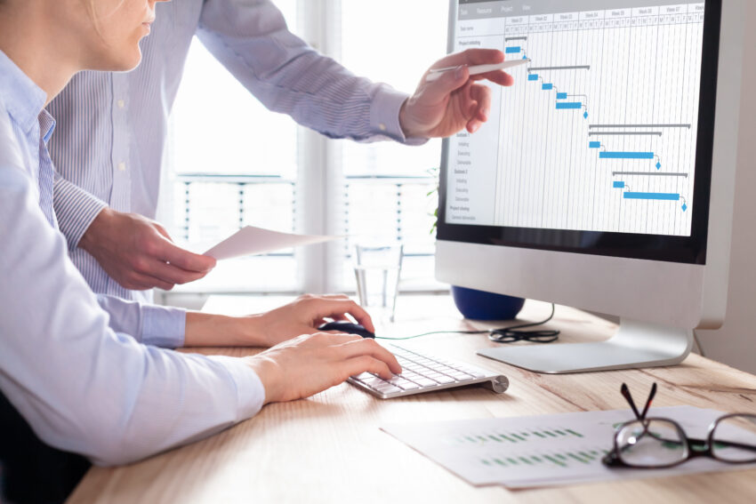 Project,Management,Team,Updating,Gantt,Chart,Schedule,Or,Planning,On