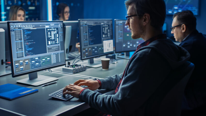 Smart,Male,It,Programer,Working,On,Desktop,Green,Mock-up,Screen