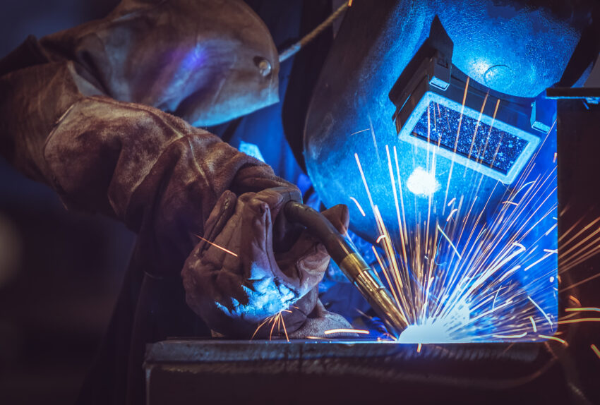 Industrial,Worker,Labourer,At,The,Factory,Welding,Steel,Structure