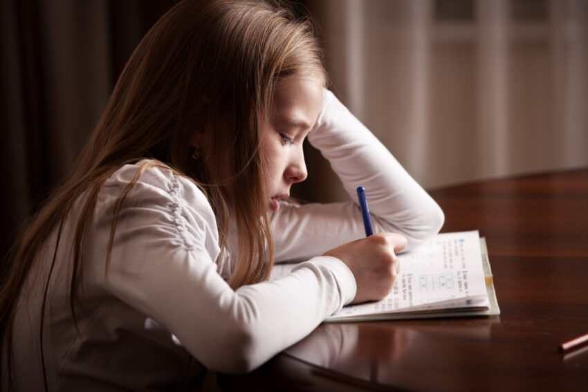 Child,Doing,Homework.,Sad,Girl,Writing,,Reeding